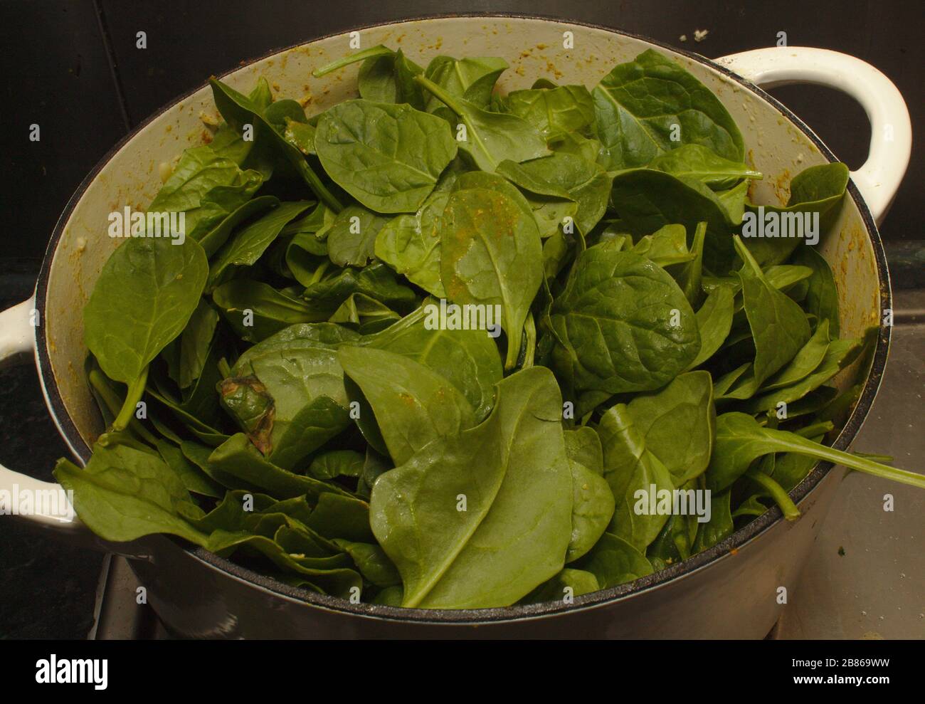 Spinach leaves in pot Stock Photo - Alamy