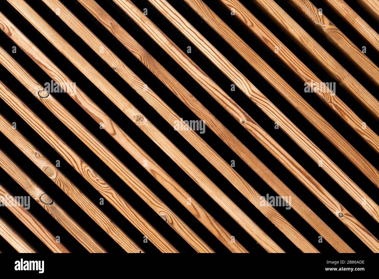 Background of wooden slats. Natural wooden plank on the wall diagonally. texture for background Stock Photo