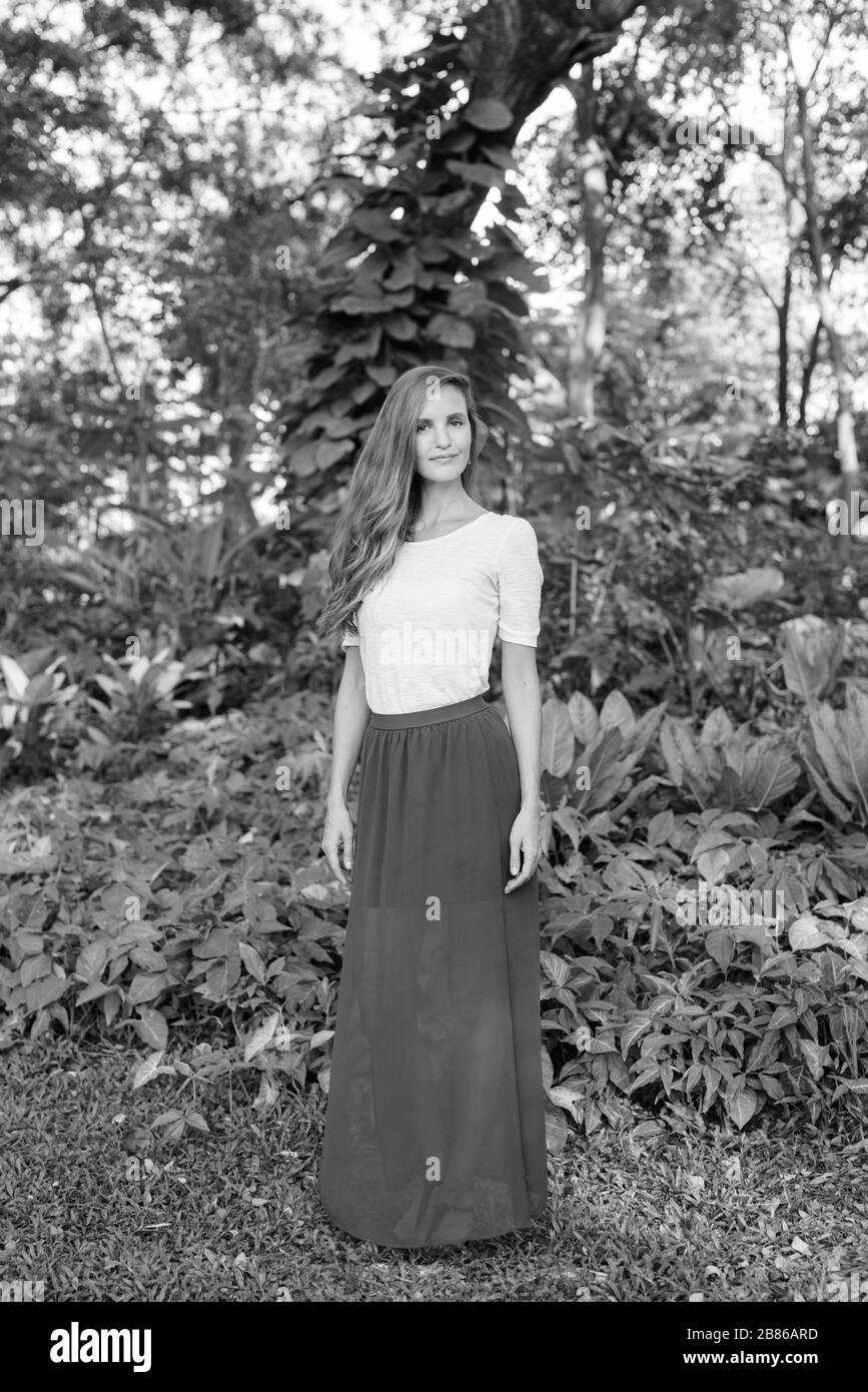 Portrait of beautiful woman relaxing at the park Stock Photo - Alamy