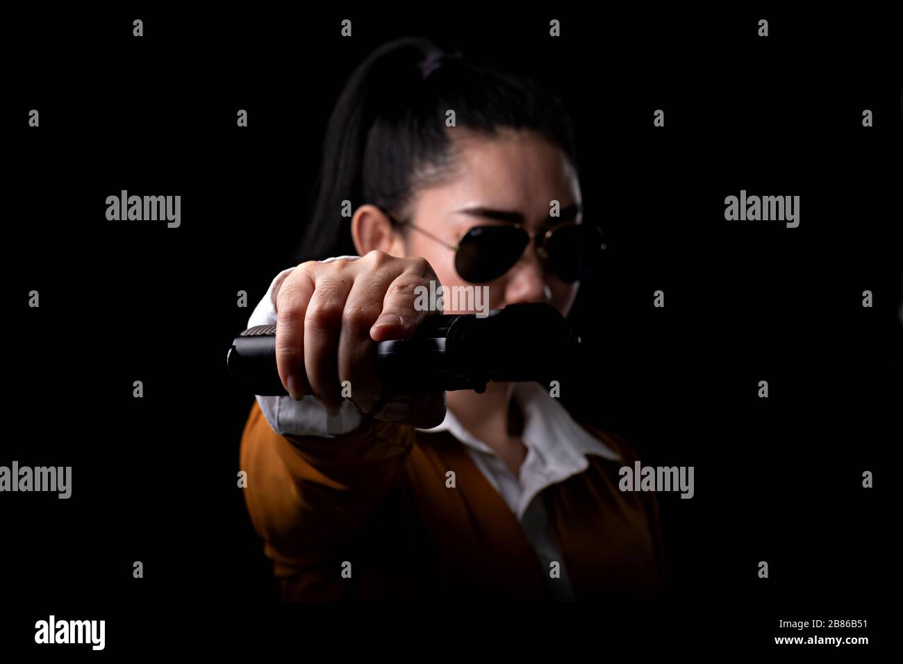 Women pointing guns look at the camera, Portrait beautiful asia woman