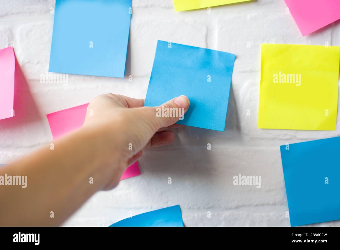 Plan made with colored empty notes on white wall Stock Photo - Alamy