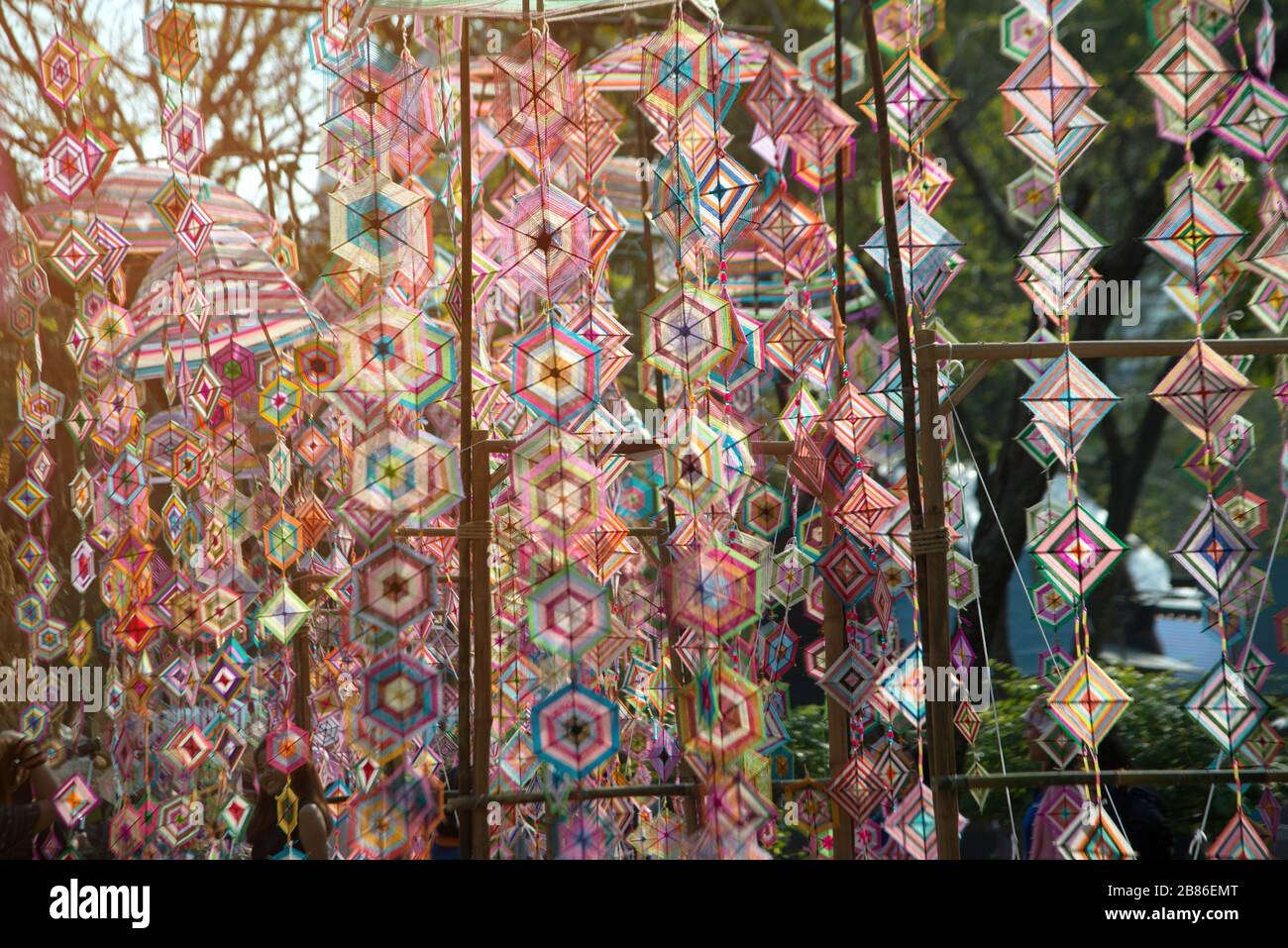 The colorful spider tung web flag in local Thai traditional merit old style for protect is widespread decorate flags in religion in the Thailand. Stock Photo