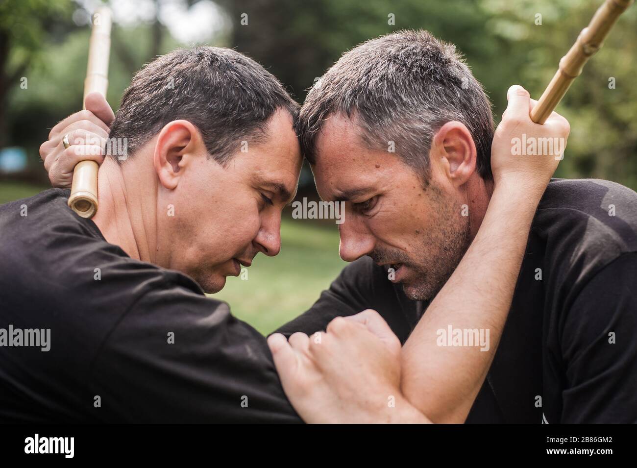 Instructor and student practice filipino escrima stick fighting technique. Martial  arts demonstration Stock Photo - Alamy