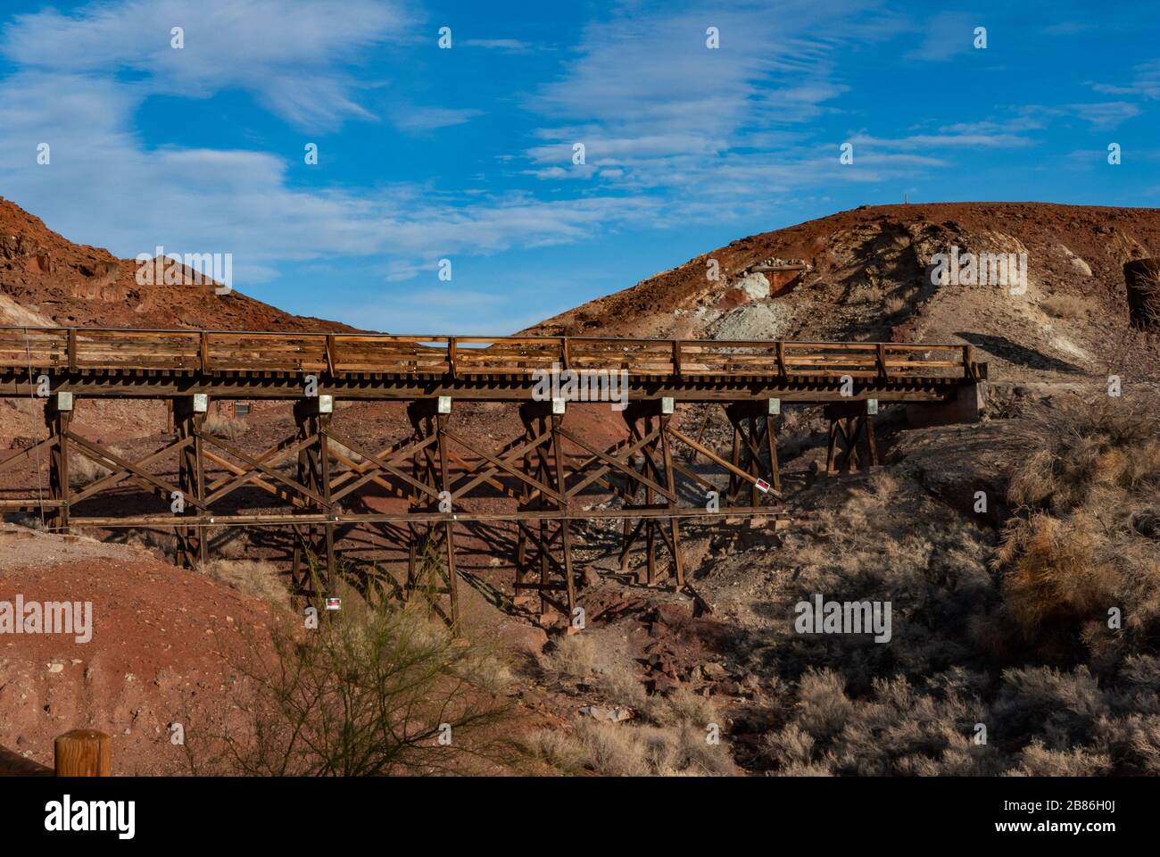 Old wooden railway bridge in Calico Ghost Town, former silver mine. Mojave desert, California, USA. Stock Photo