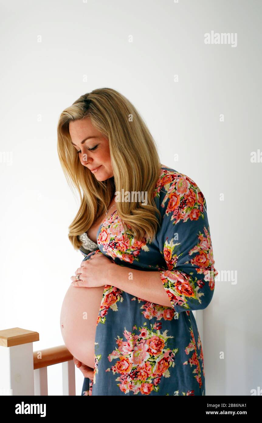woman nine months pregnant at home Stock Photo