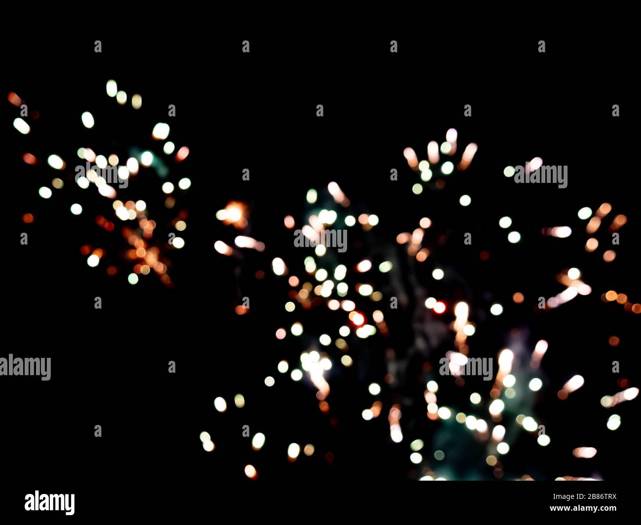 Colorful fireworks on the black sky background. Celebration. Stock Photo