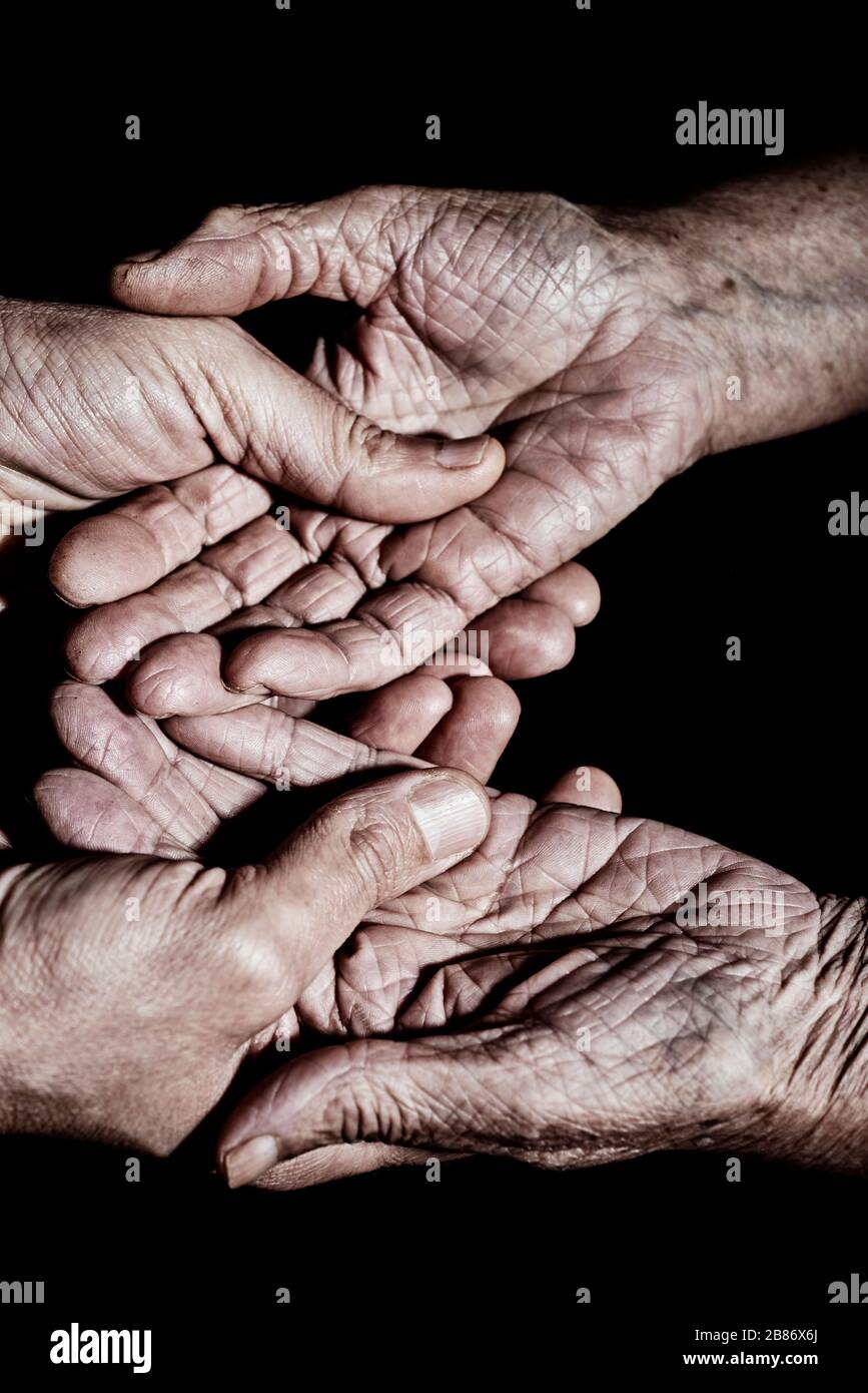 Old woman young man holding hands hi-res stock photography and images ...