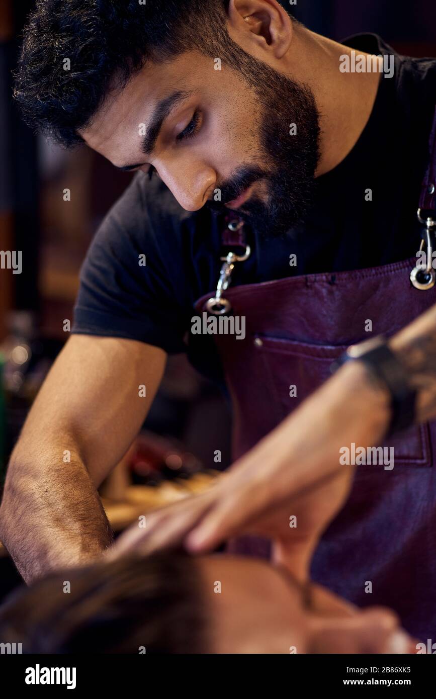 Shaving process of beards in Master makes the client shave