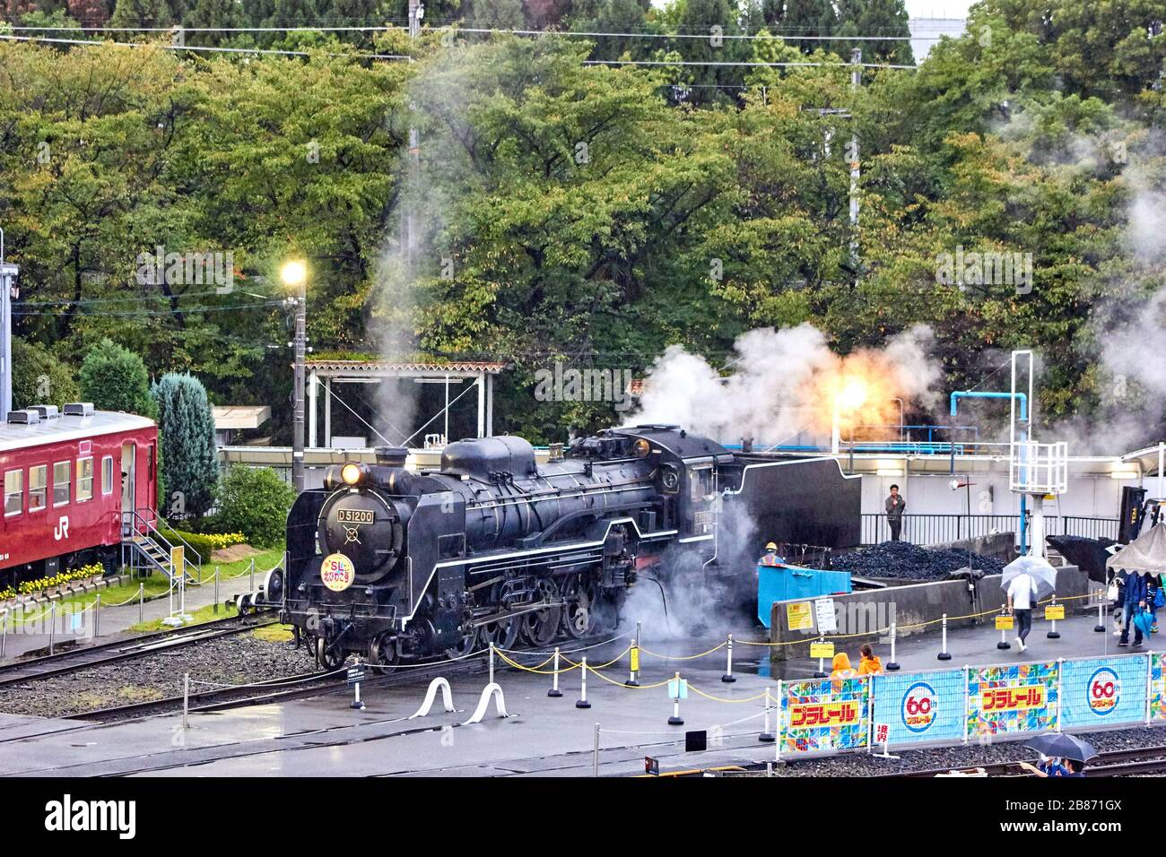 Running Steam Train In The Rain Stock Photo Alamy