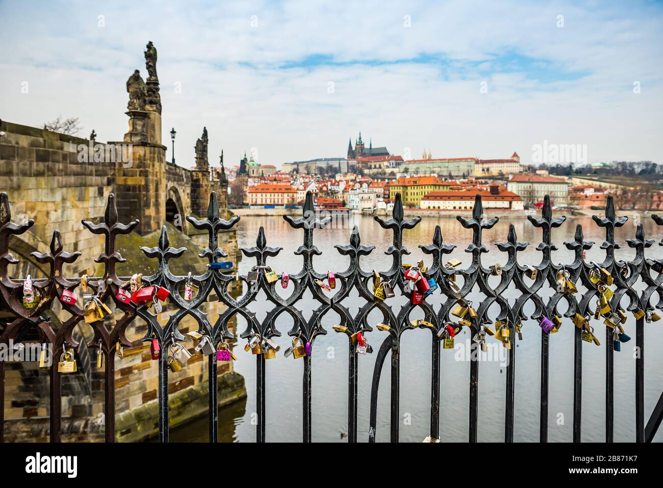 Prague, Czech republic - March 19, 2020. Lockers of the lovers on the fence  by Charles Bridge with Prague Castle view Stock Photo - Alamy