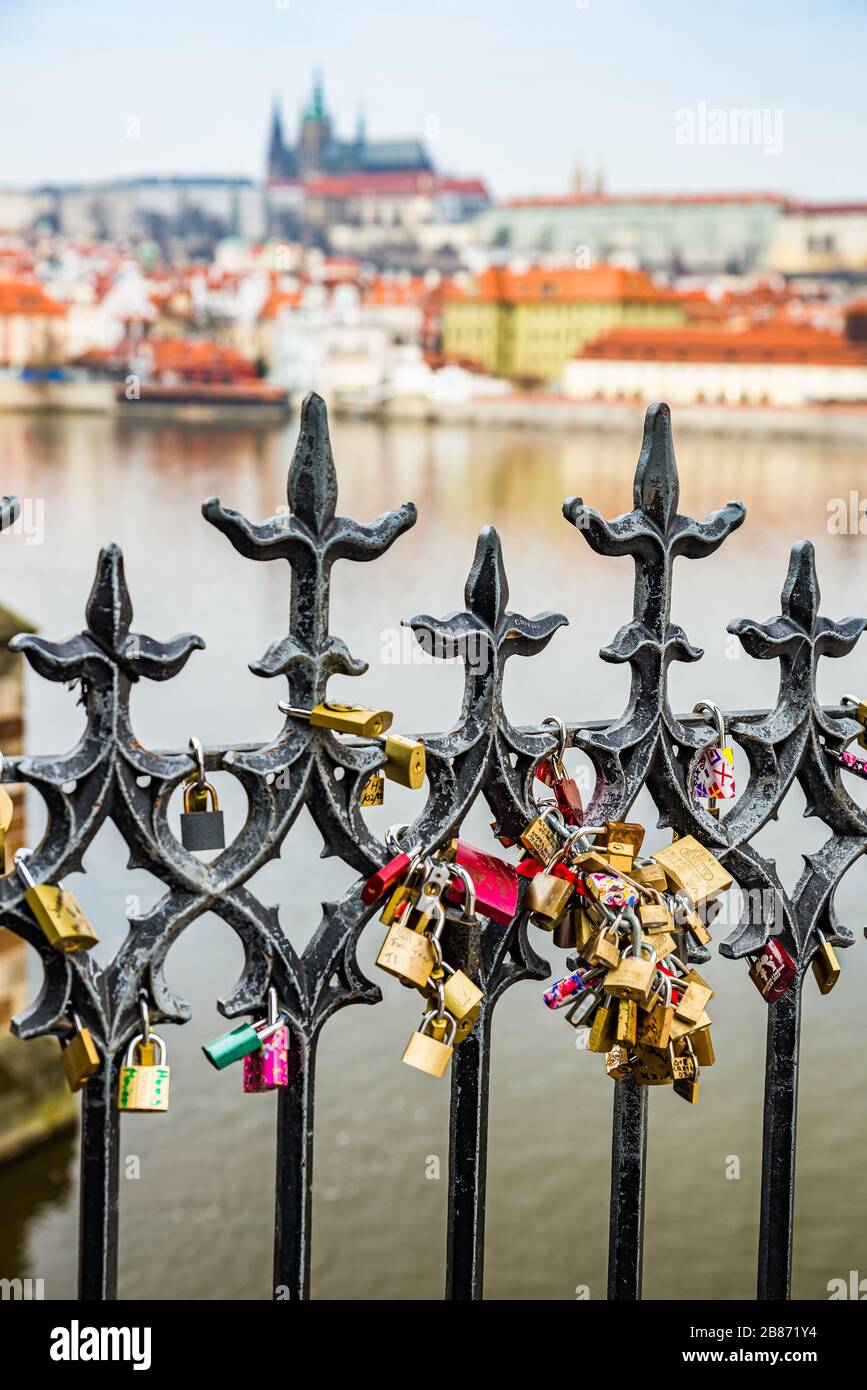 Prague, Czech republic - March 19, 2020. Lockers of the lovers on the fence  by Charles Bridge with Prague Castle view Stock Photo - Alamy