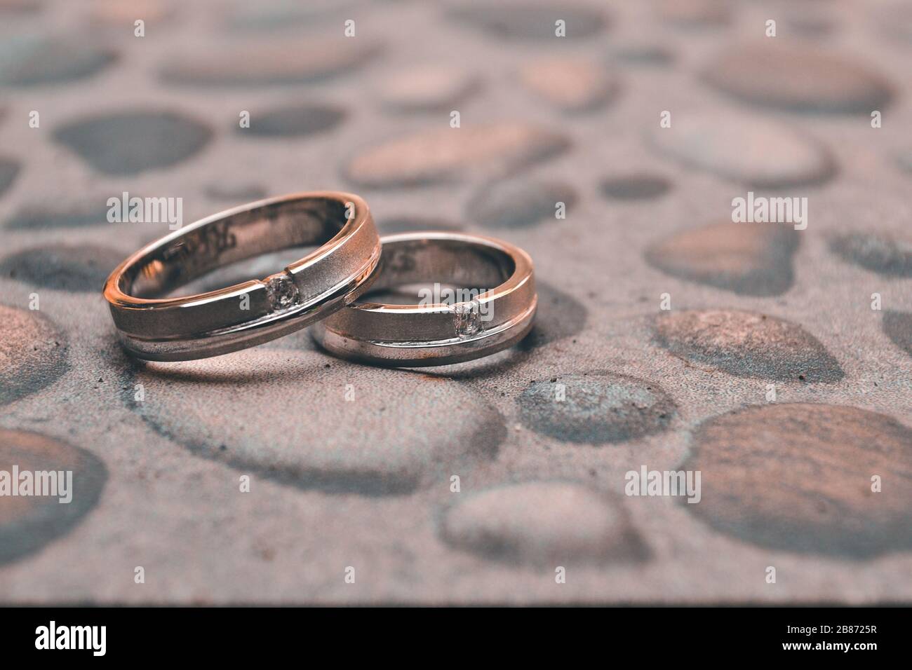 A pair of engagement rings as a symbol of two people's love Stock Photo