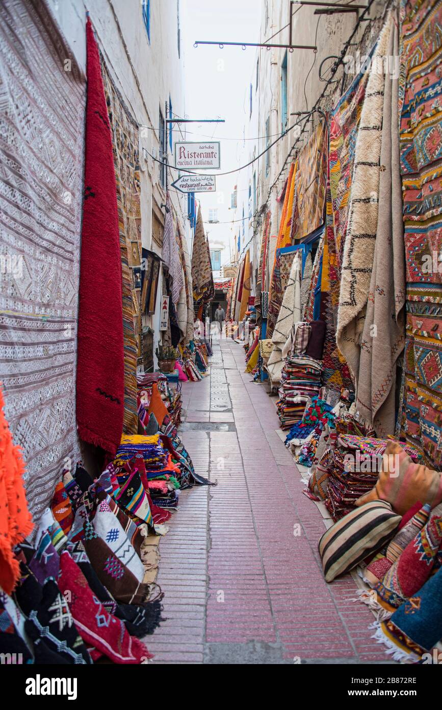 Essaouria, Morocco - September 2017: carpet lined walls of an alley in the medina Stock Photo