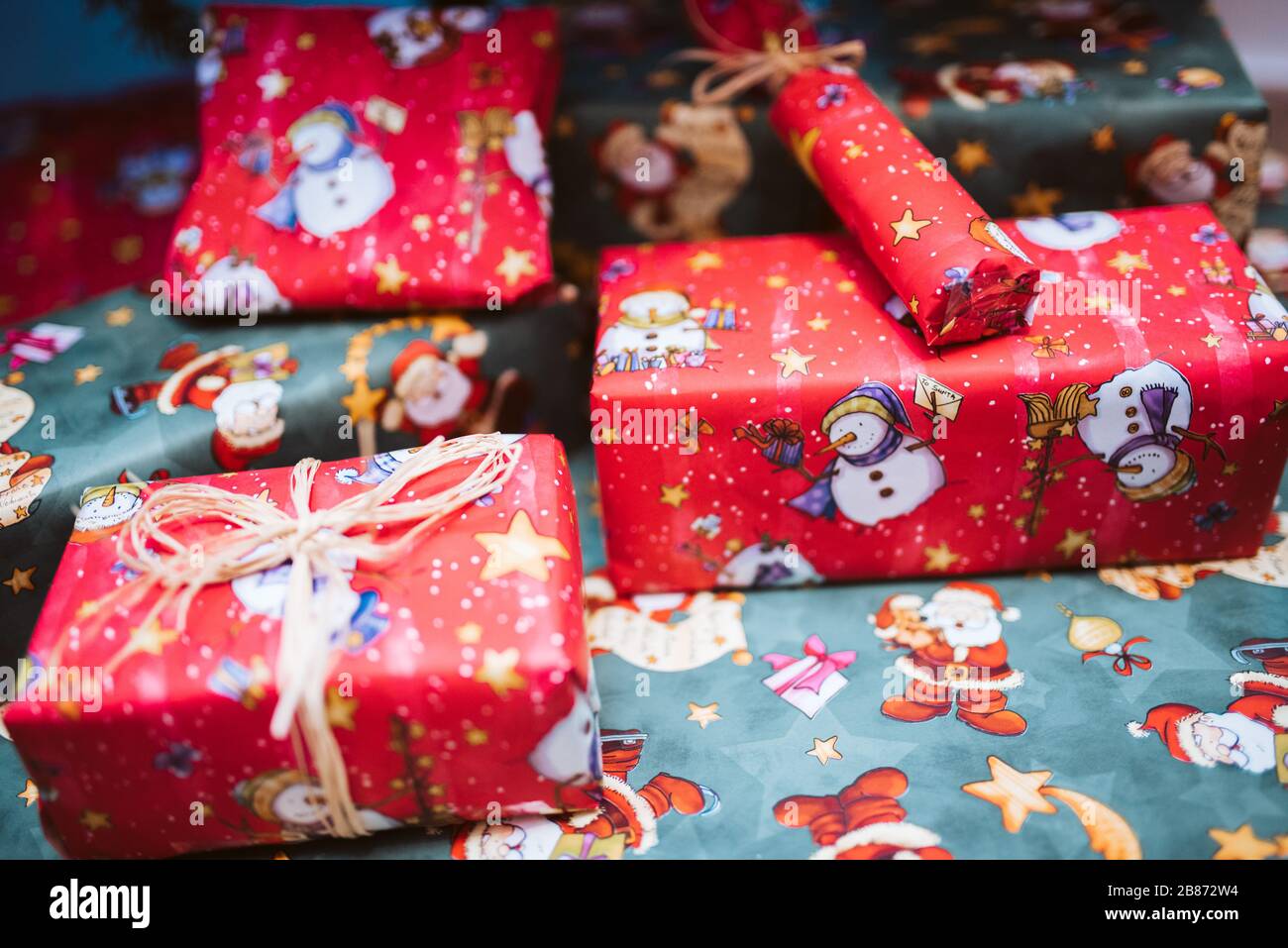 pile of colorful Christmas presents under the tree Stock Photo