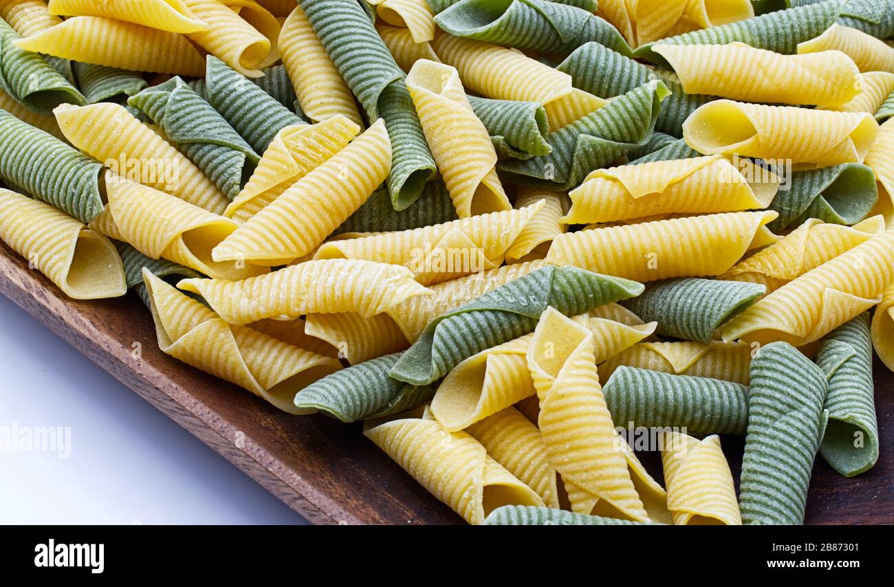 Italian raw colored pasta. Maccheroni al pettine Stock Photo Alamy