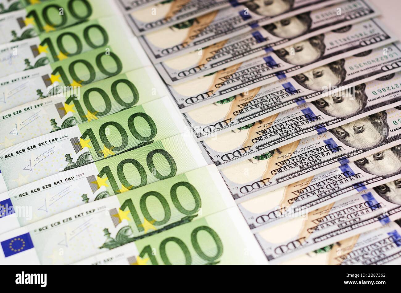 hundred dollar bills and bills of one hundred euros beautifully laid out 2 Stock Photo