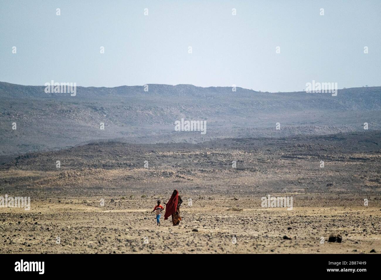Africa, Djibouti, Lake Abbe. Landscape view of lake Abbe A mother and child are walking next in lake Abbe's desert Stock Photo