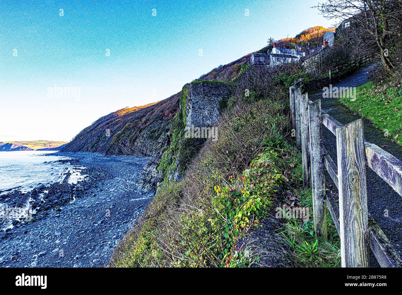 Colourful Bucks Mills High Tide View of the Beach With Bright Coloured Wet Pebbles, North Devon Coastline, Footpath and Lime Kiln; Bucks Mills, Devon, Stock Photo