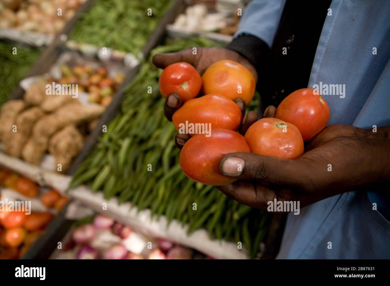 A Nairobi City Market trader shows his goods on March 7, 2011. Stock Photo