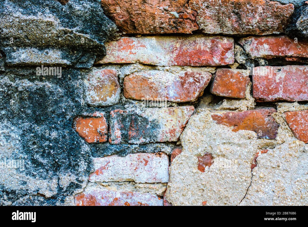 Old vintage brick wall in Lopburi, Thailand. Weathered brick wall texture background at old temple. Stock Photo