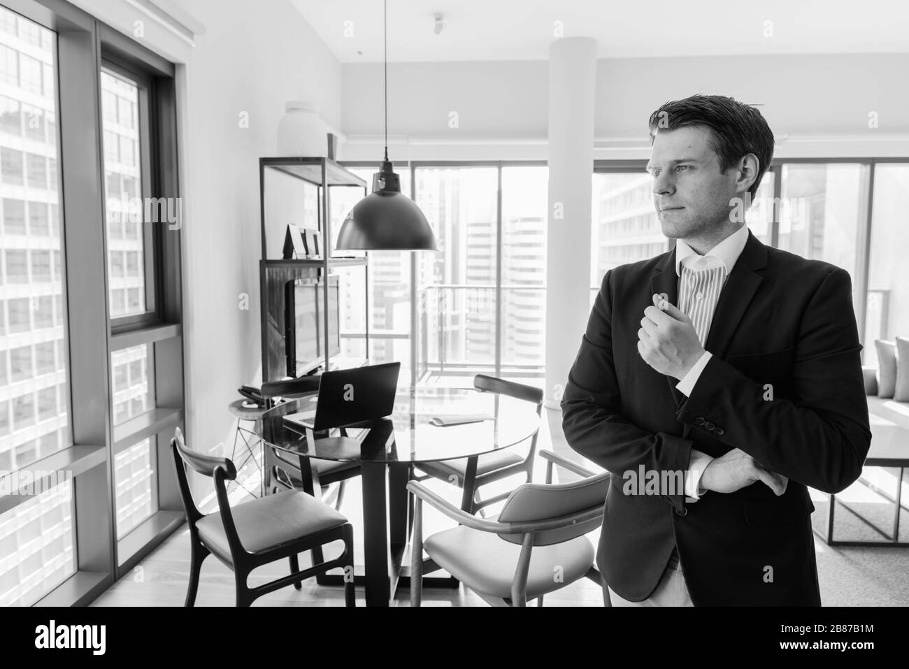 Young handsome businessman relaxing in the living room Stock Photo