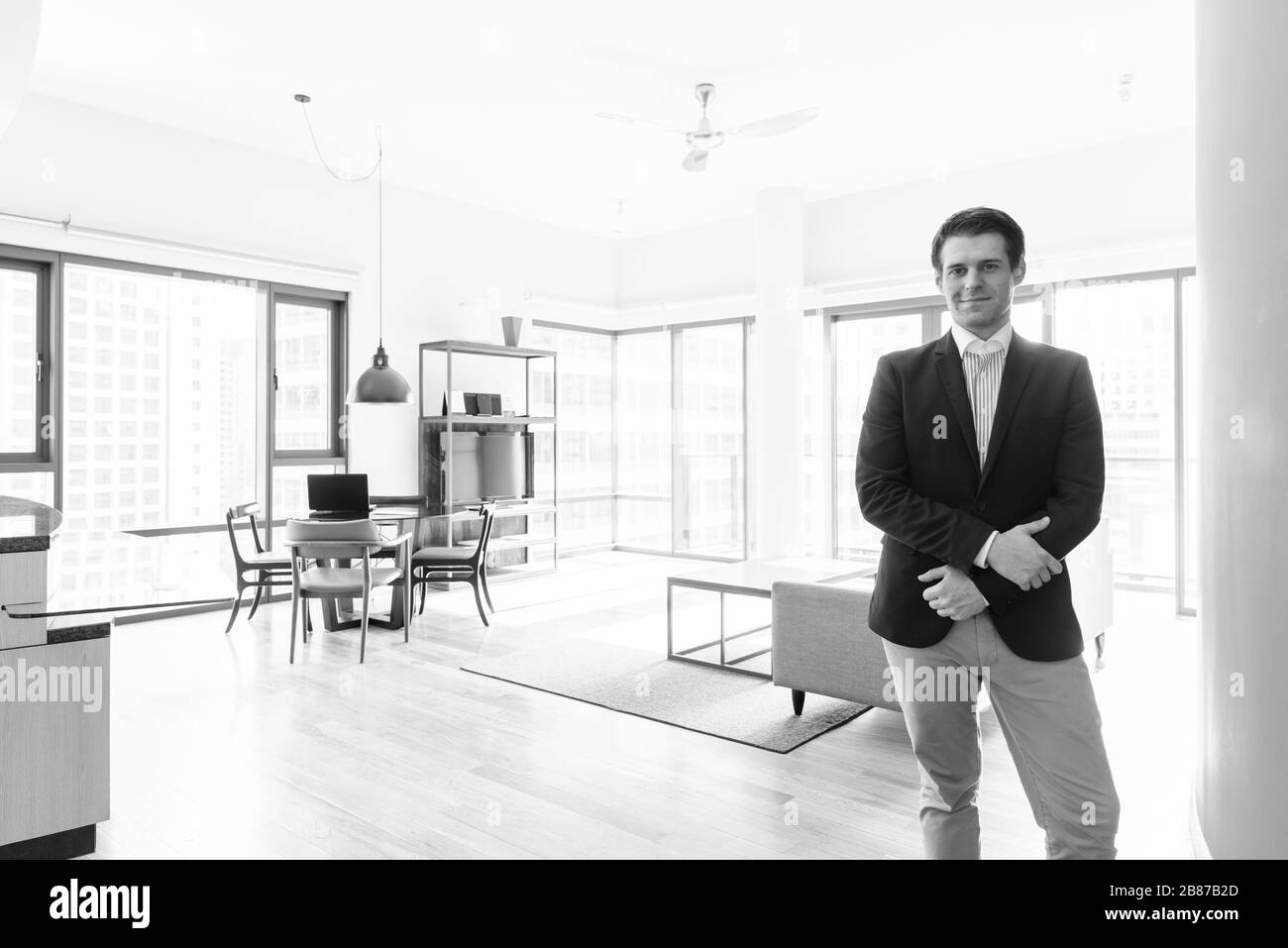 Young handsome businessman relaxing in the living room Stock Photo