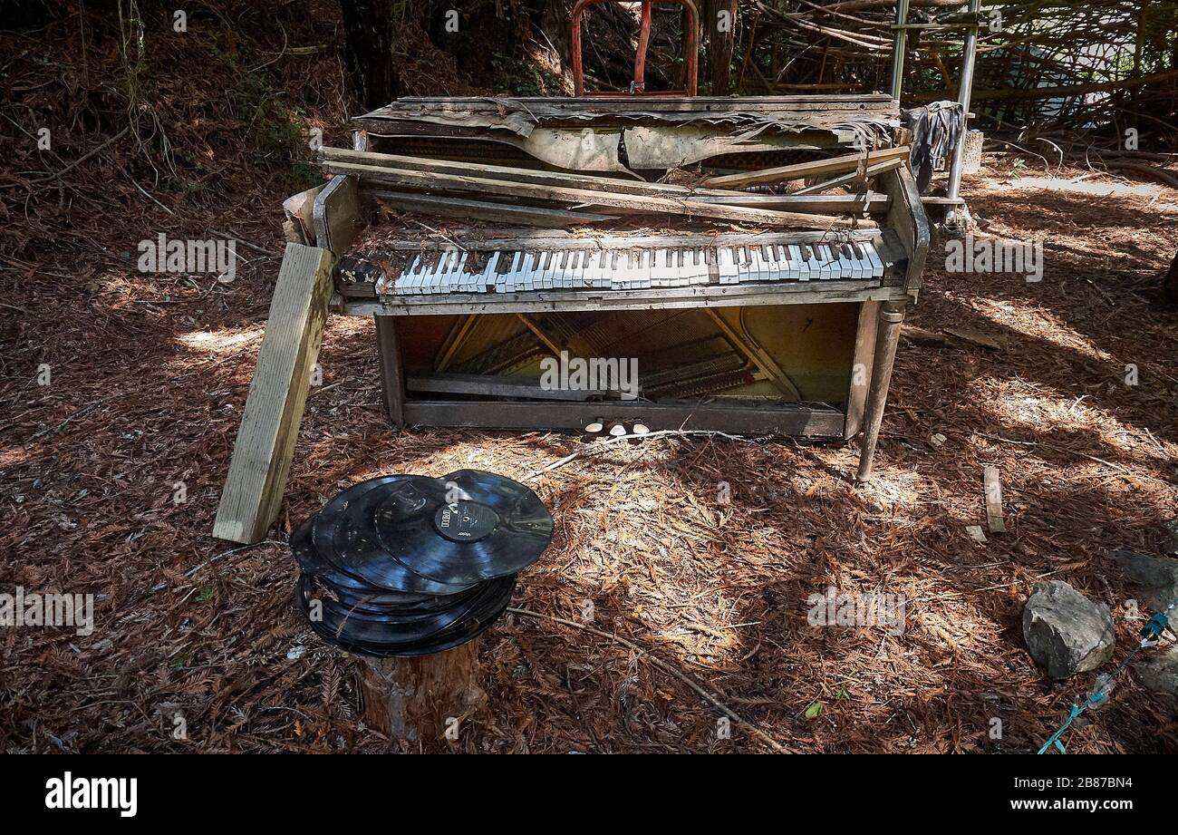 A rotten Piano in the garden of the Henry Miller Memorial Library in Big Sure. Stock Photo