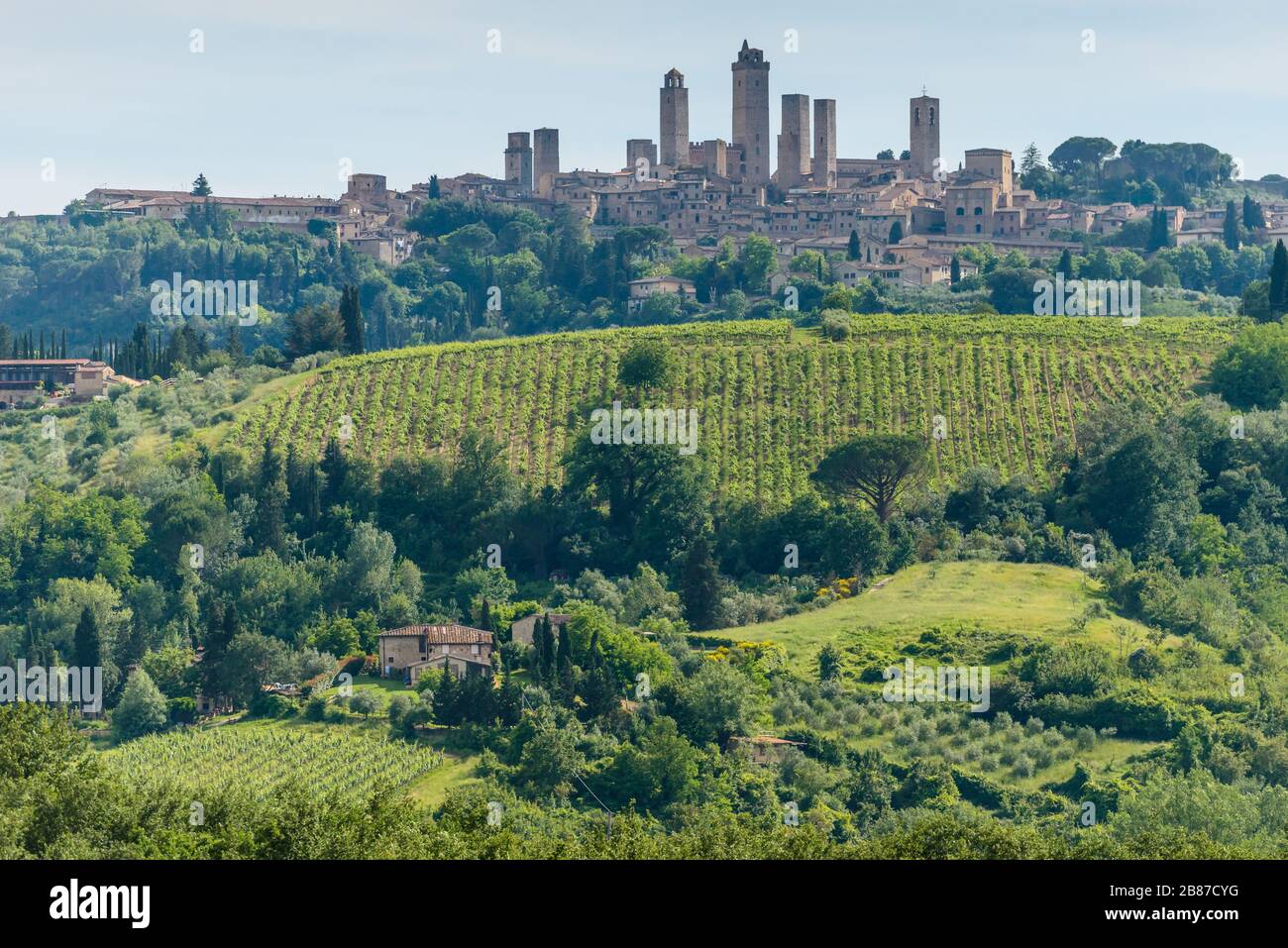 Skyline of the hill town of San Gimignano with its 14 tall towers, known as Medieval Manhattan, set among rolling hills of Tuscan countryside, Italy Stock Photo