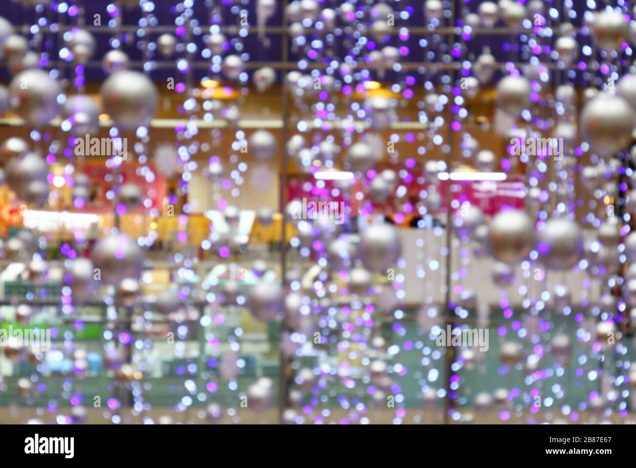 blurred background bokeh light abstract of Interior lighting department store, lighting decoration in shopping mall Stock Photo
