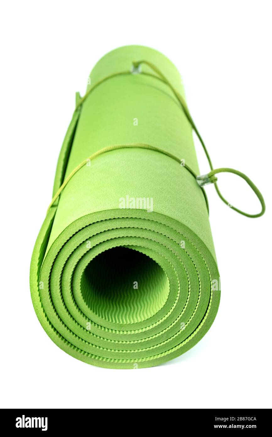 Green rolled sleeping mat isolated on white background Stock Photo Alamy