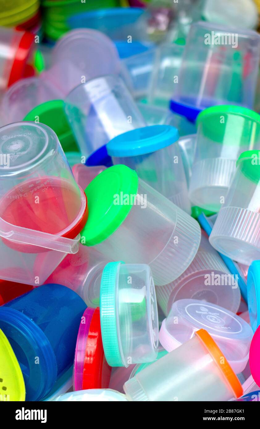 Pile of plastic containers result of massive industrial production. Eco concept. Stock Photo