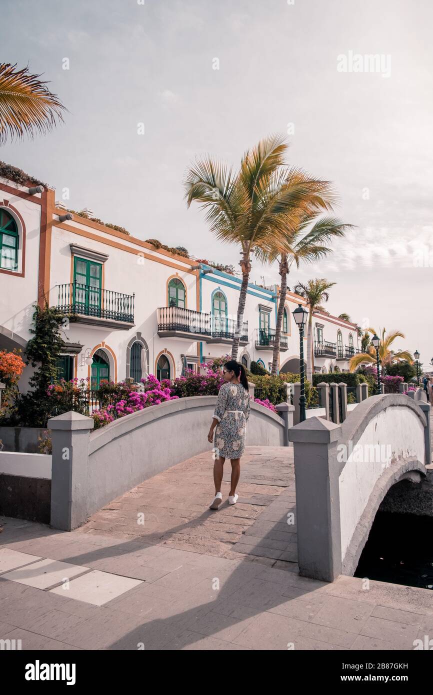 Puerto de Mogan Gran Canaria, colorful harbor village Gran Canaria, young woman walking whitewashed colorful village Stock Photo
