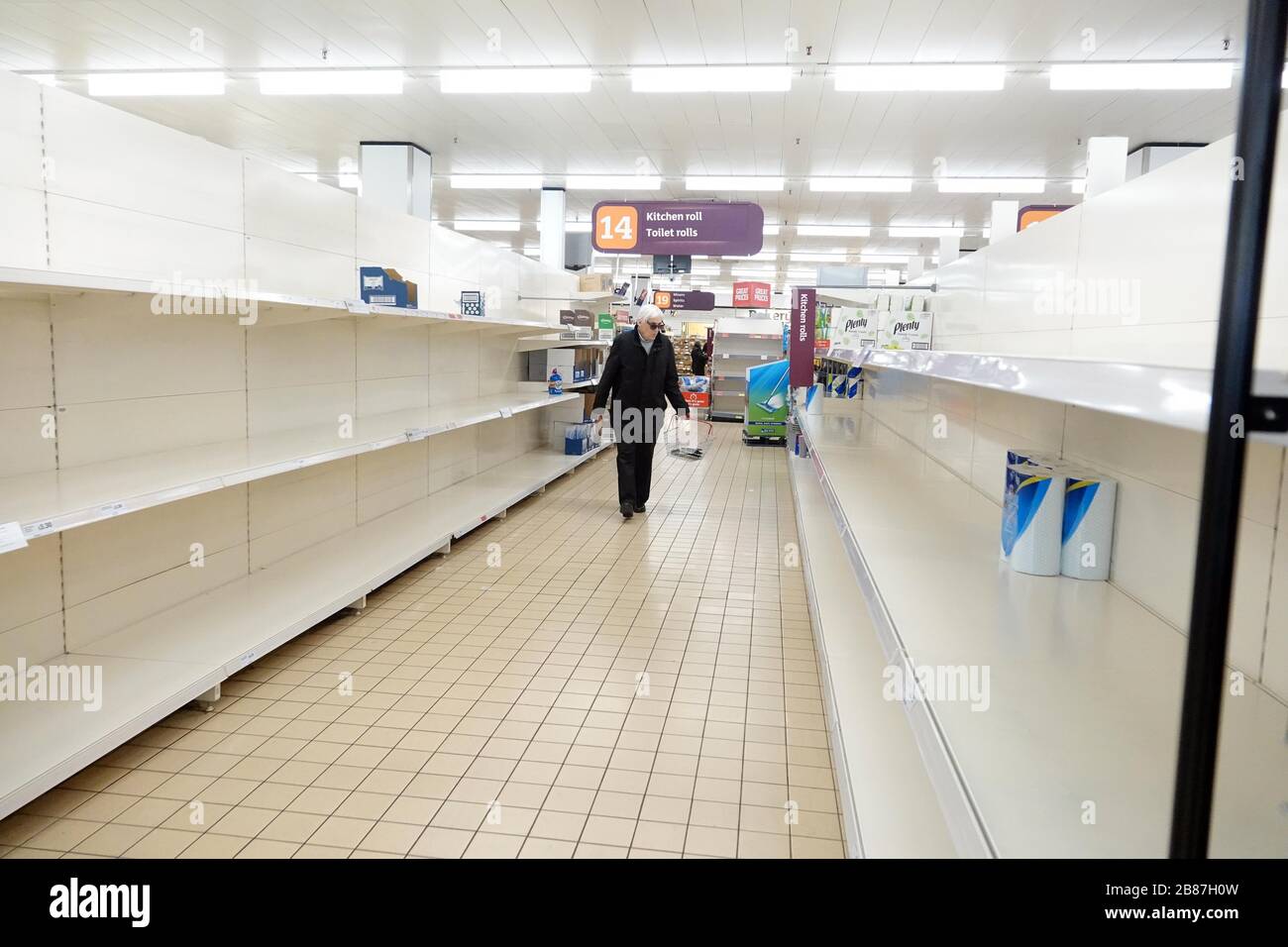 pic shows empty shelves at Sainsbury’s Toilet rolls all gone with just