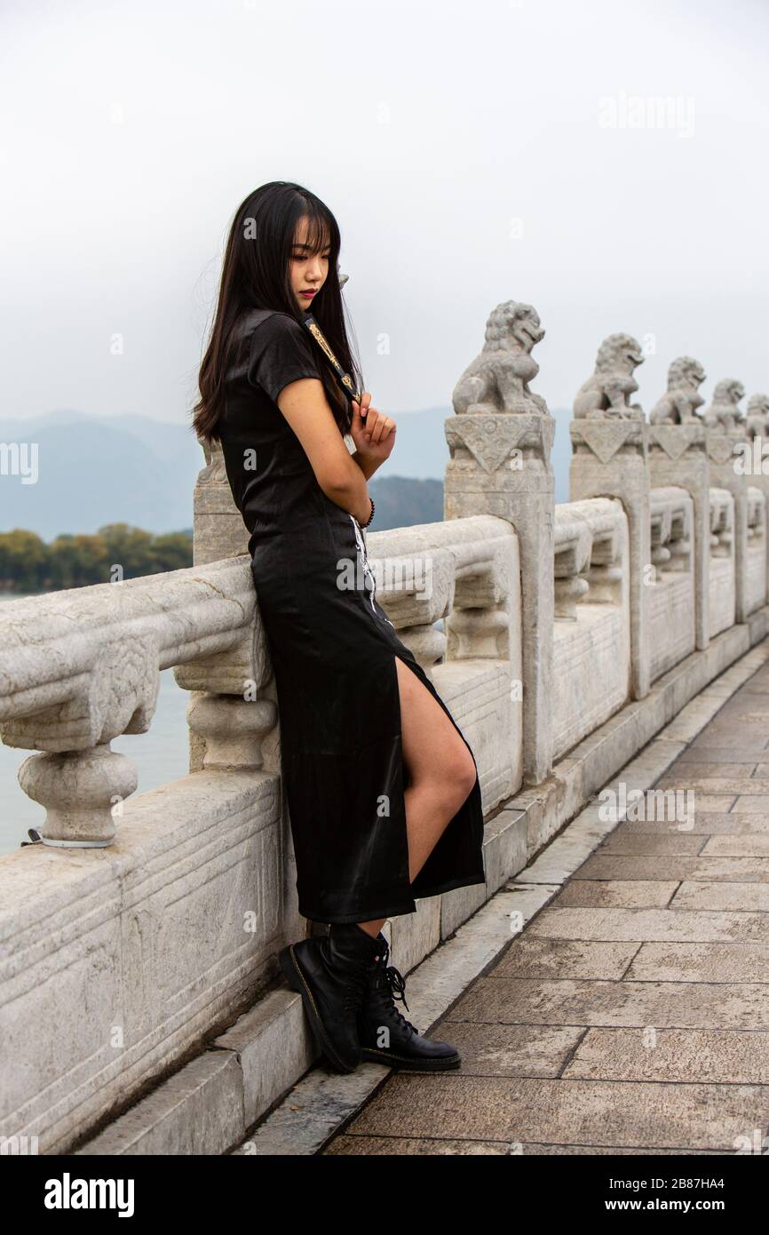Chinese girl in cheongsam at Summer Palace, Beijing Stock Photo