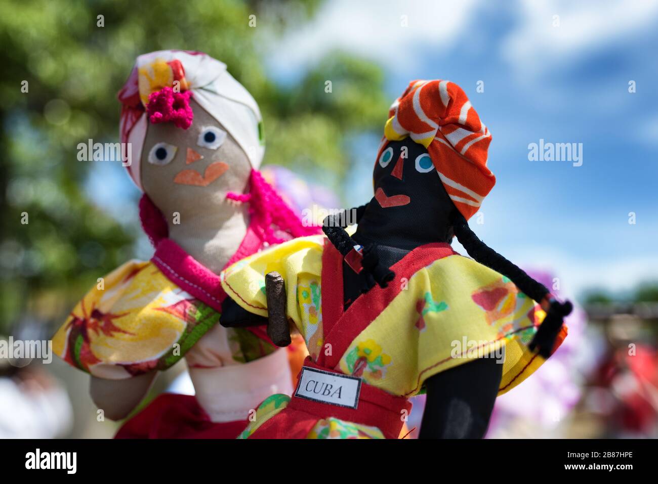 Portrait of Cuban rag dolls in traditional costume. Cuba handmade souvenir. Stock Photo