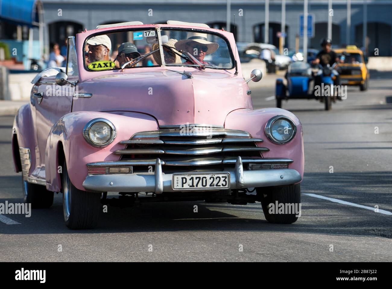 Pink vintage american car running at Malecon, one of the most famous Havana road. Old Chevrolet. Stock Photo