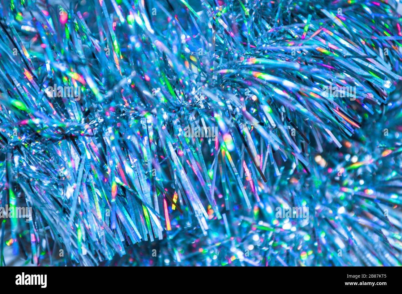 Christmas blue garland. Party celebration texture. Colorful  blue Christmas tinsel Stock Photo