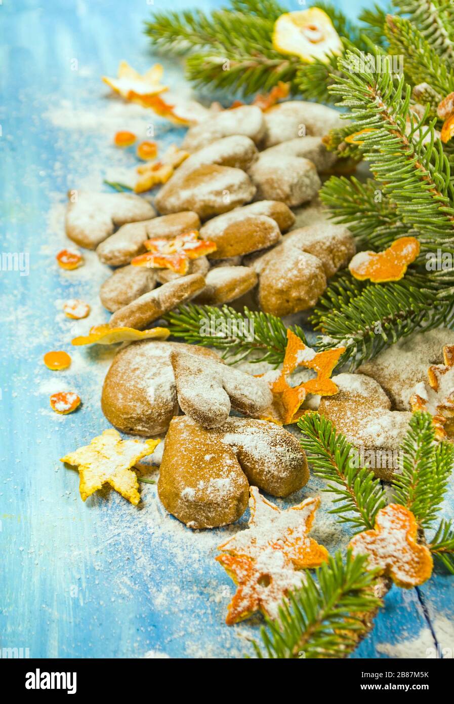 Materials for making a Christmas wreath. Christmas wreath with natural decorations on rustic wooden background with copy space. Stock Photo
