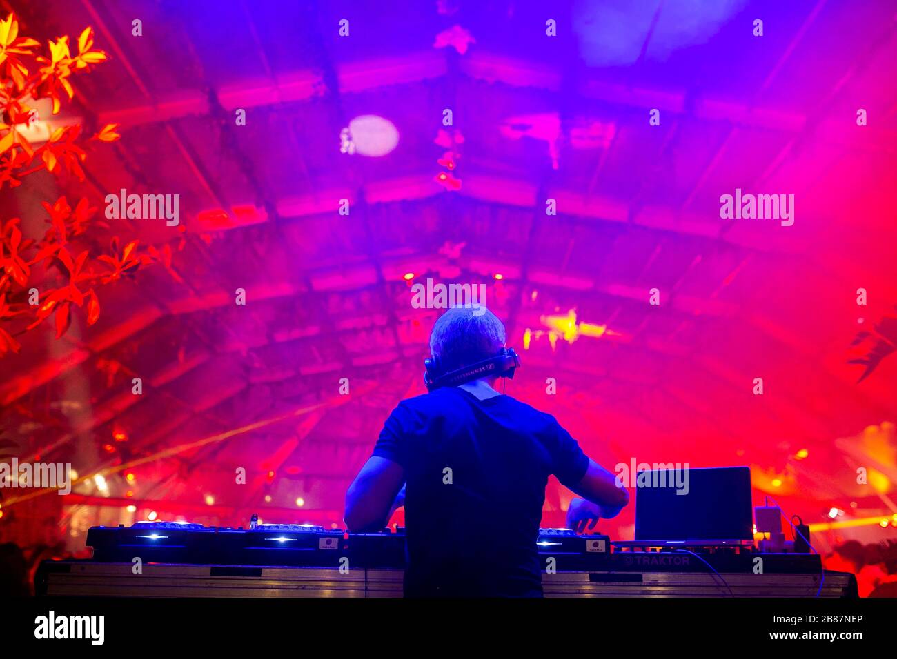 DJ with headphones at a private party. Stock Photo