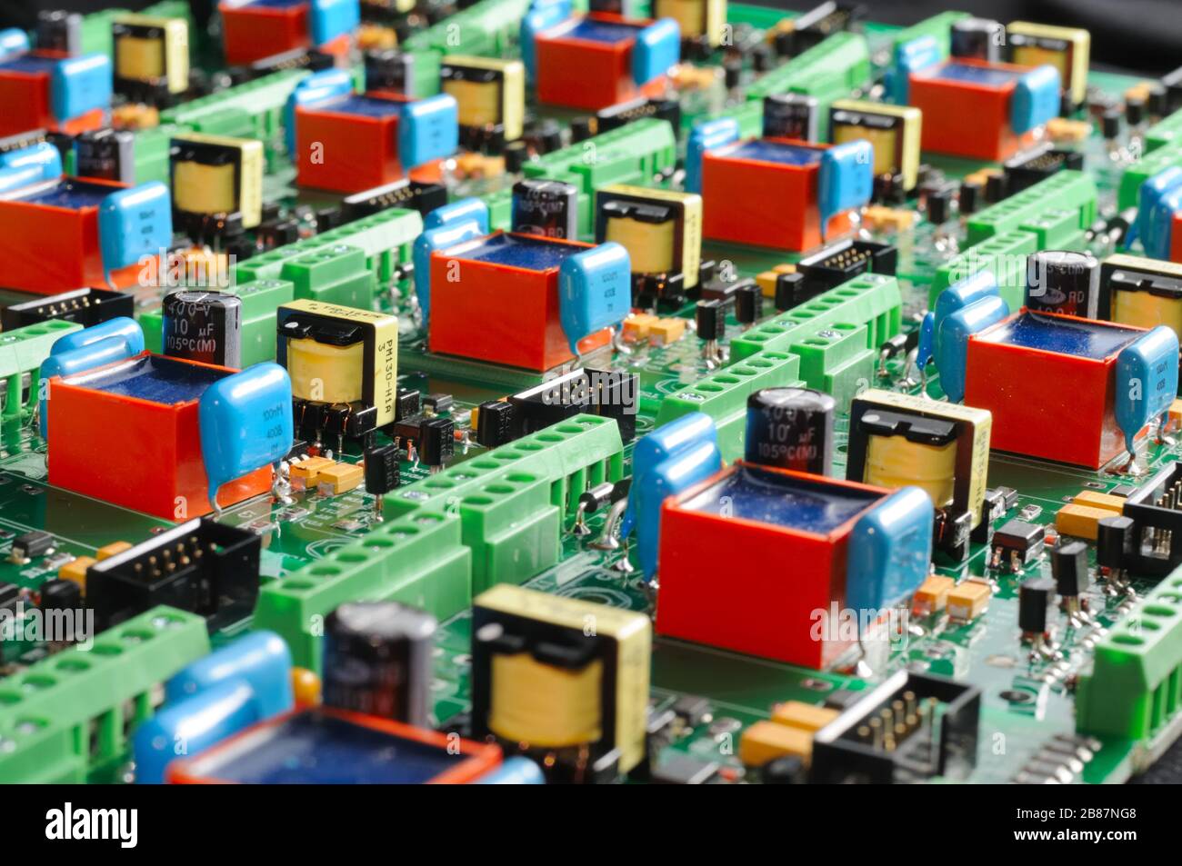 A large number of green boards with electronic components. Complex