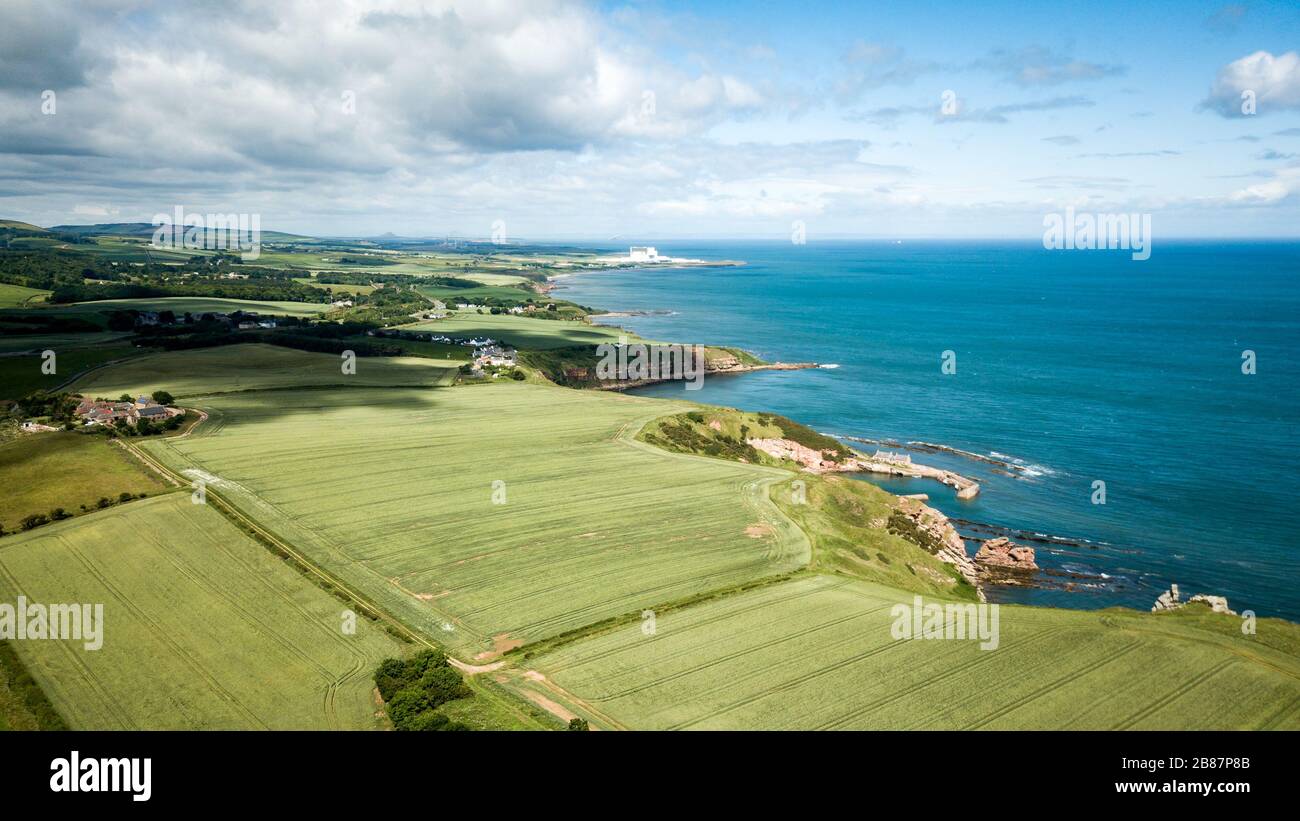 Northumberland countryside and coastline. Aerial drone view of the north east landscape into the North Sea with Lynemouth Power Station visible. Stock Photo