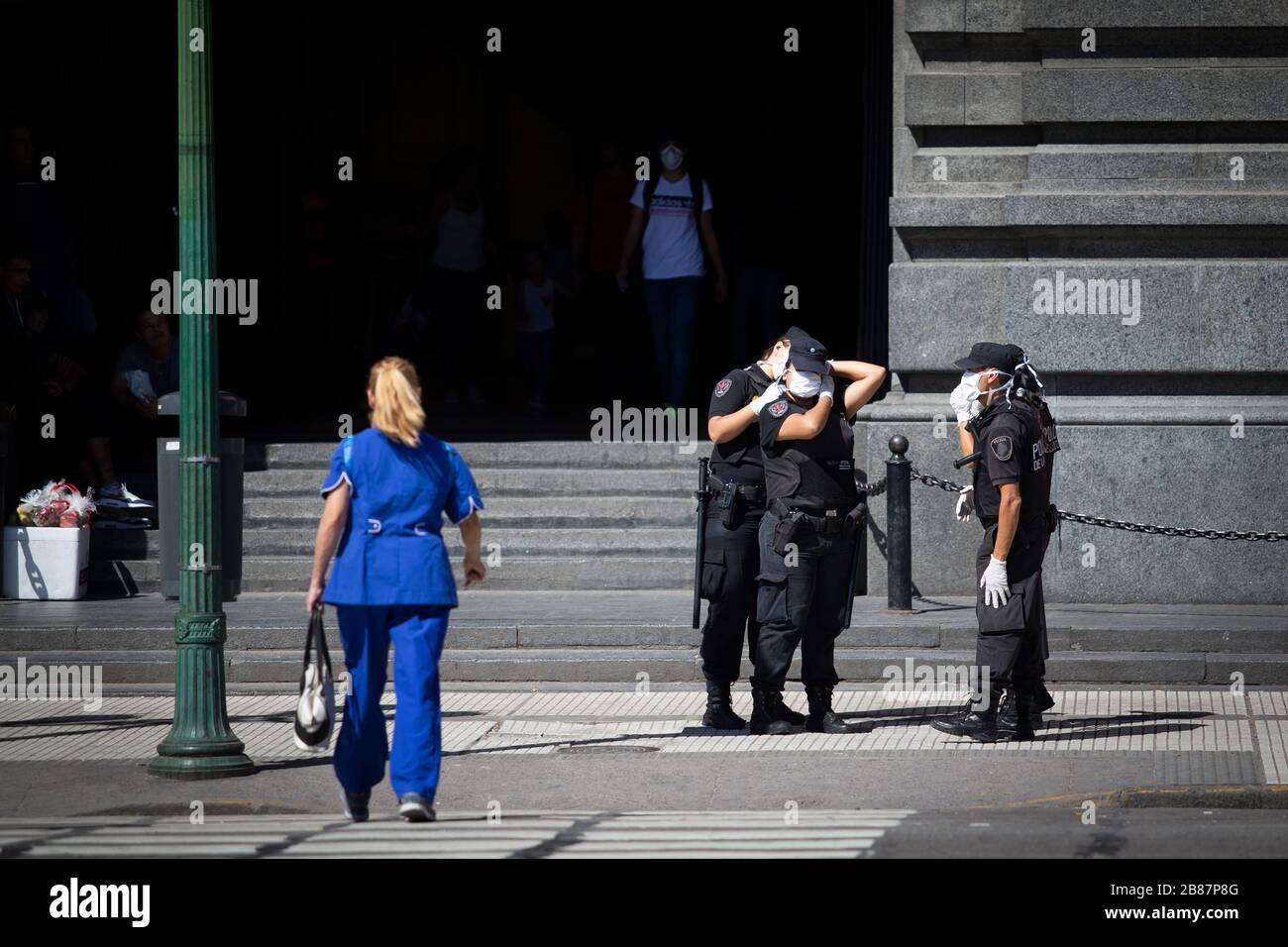 Buenos Aires, Argentina - March 20, 2020: Police putting the chinstrap masks the day after the state of emergency quarentine In Buenos Aires, Argentin Stock Photo