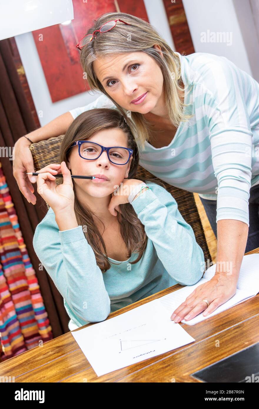pretty student girl taking mathematics courses on Pythagoras theorem ...