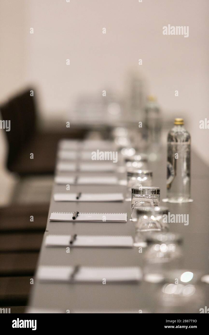 Set up table in a meeting room Stock Photo - Alamy