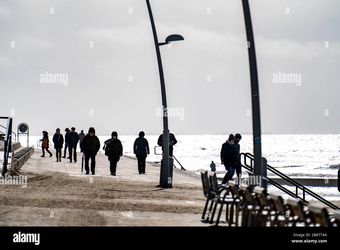 Beach promenade, walkers, beach in the west of Borkum, island, East Frisia, winter, season, autumn, Lower Saxony, Germany, Stock Photo
