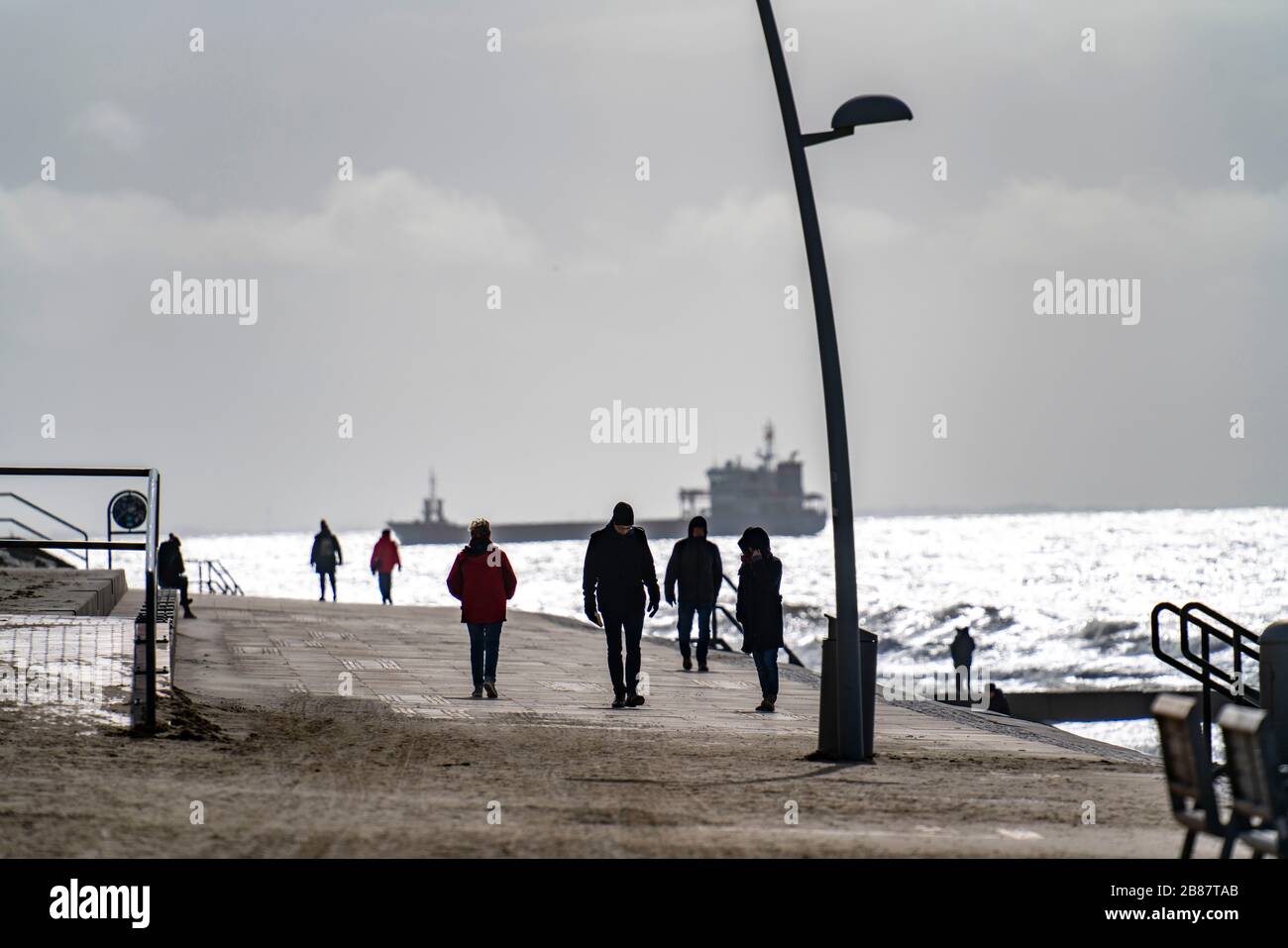 Beach promenade, walkers, beach in the west of Borkum, island, East Frisia, winter, season, autumn, Lower Saxony, Germany, Stock Photo