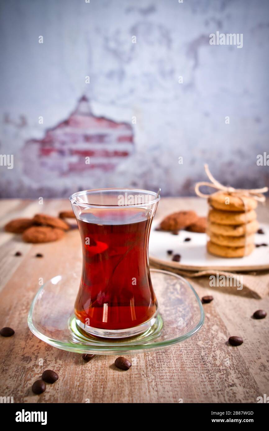 Beautifully stacked cookies with chocolate on Wooden table. Chocolate chip cookies Vintage Color. Traditional Turkish Tea. Stock Photo