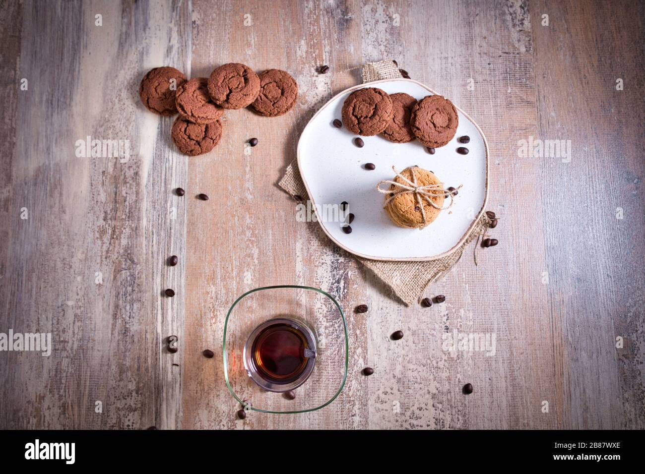 Beautifully stacked cookies with chocolate on Wooden table. Chocolate chip cookies Vintage Color. Traditional Turkish Tea. Stock Photo