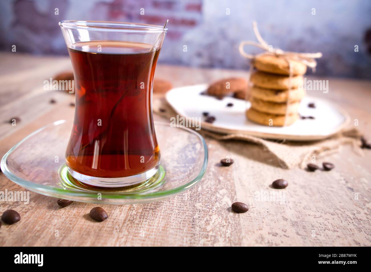 Beautifully stacked cookies with chocolate on Wooden table. Chocolate chip cookies Vintage Color. Traditional Turkish Tea. Stock Photo