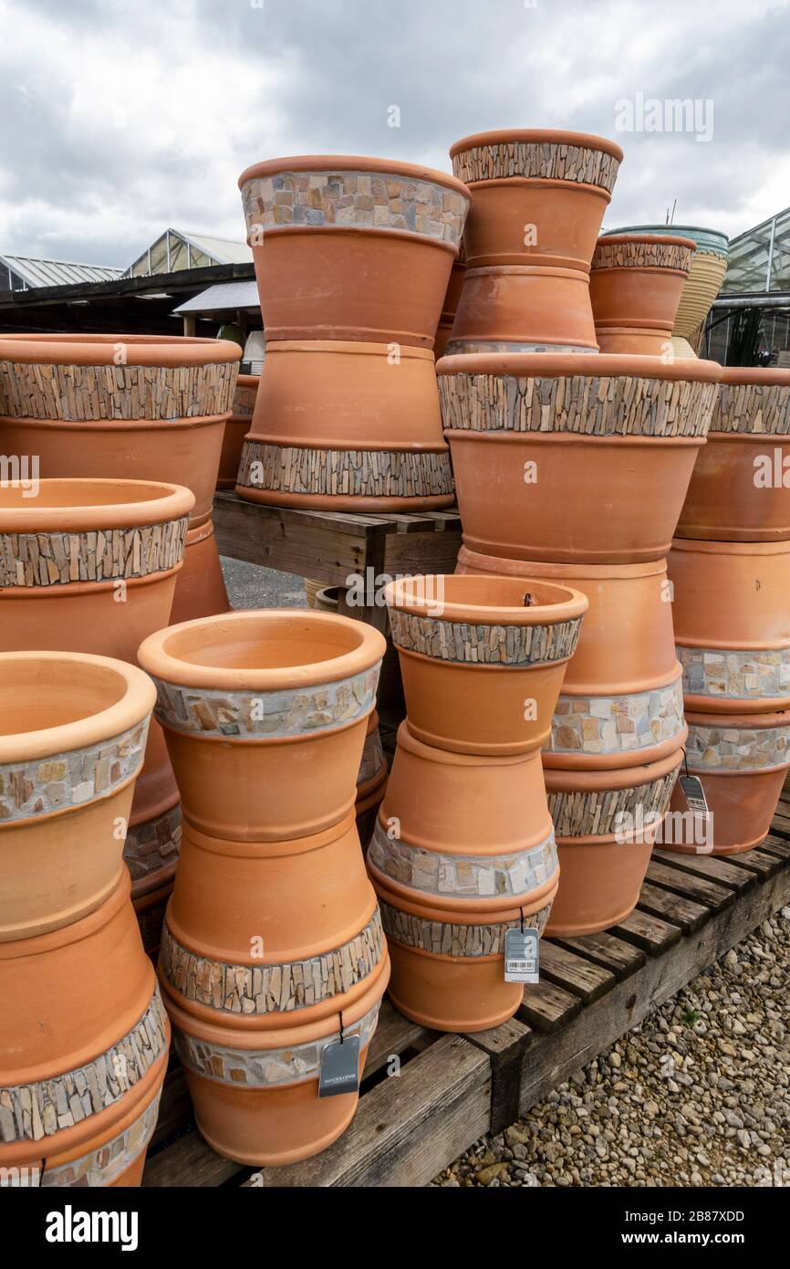 Close up of a stack of Decorative garden pots for sale at a Garden